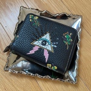 Coach black small zip around wallet with pyramid eye